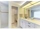 Bright bathroom with a single sink vanity with granite countertop and tiled floor at 3217 Oak Grove Dr, Sarasota, FL 34243