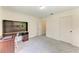Bedroom featuring carpet, a desk, and two doors at 3217 Oak Grove Dr, Sarasota, FL 34243