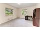 Bedroom with carpet, desk, and windows looking out on the exterior landscape at 3217 Oak Grove Dr, Sarasota, FL 34243