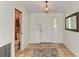Foyer featuring tile flooring, chandelier and view to a nearby bathroom at 3217 Oak Grove Dr, Sarasota, FL 34243