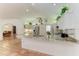 Modern kitchen with granite countertops, white cabinetry, and terracotta tile flooring at 3217 Oak Grove Dr, Sarasota, FL 34243