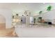 Modern kitchen with granite countertops, white cabinetry, and terracotta tile flooring at 3217 Oak Grove Dr, Sarasota, FL 34243