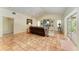 Spacious living room with terracotta tile flooring and a built-in entertainment center at 3217 Oak Grove Dr, Sarasota, FL 34243