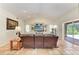 Comfortable living room features a built-in entertainment center and sliding glass doors at 3217 Oak Grove Dr, Sarasota, FL 34243