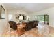 Inviting living room featuring tile floors, sliding glass doors, and views of the pool at 3217 Oak Grove Dr, Sarasota, FL 34243