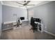 Bedroom with neutral walls and carpet, featuring wall-mounted shelves and game-themed decor at 3355 Hilltop Cir, Bradenton, FL 34211