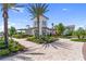 A modern clubhouse is surrounded by manicured gardens and walkways, offering a welcoming gathering place at 3355 Hilltop Cir, Bradenton, FL 34211