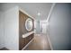 Bright entryway with wood accent wall and decorative wall details leading to front door at 3355 Hilltop Cir, Bradenton, FL 34211