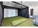 An indoor golf simulator room is perfect for practicing your swing in a comfortable setting at 3355 Hilltop Cir, Bradenton, FL 34211