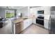 Modern kitchen with stainless steel appliances, granite countertops, and ample cabinet space at 3355 Hilltop Cir, Bradenton, FL 34211