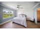 Inviting bedroom with a decorative wall, large window, and stylish furnishings at 3355 Hilltop Cir, Bradenton, FL 34211