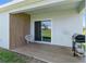 Covered patio area with a grill and seating, perfect for outdoor relaxation at 3355 Hilltop Cir, Bradenton, FL 34211