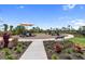 Community playground with modern play structures, seating, and lush landscaping for Gathering enjoyment at 3355 Hilltop Cir, Bradenton, FL 34211
