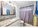 This bathroom features a granite countertop vanity and updated fixtures at 3641 Stokes Dr, Sarasota, FL 34232