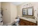 This bathroom features a granite countertop vanity and decorative lighting at 3641 Stokes Dr, Sarasota, FL 34232