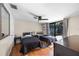 Bright bedroom with two beds, ceiling fan, and sliding doors to pool area at 3641 Stokes Dr, Sarasota, FL 34232