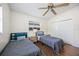 This bedroom features two twin beds, ceiling fan, closet, and natural light at 3641 Stokes Dr, Sarasota, FL 34232