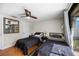 Bedroom with two beds, ceiling fan, and sliding doors to the pool area at 3641 Stokes Dr, Sarasota, FL 34232