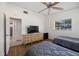 This bedroom features hardwood floors, two twin beds, and a television at 3641 Stokes Dr, Sarasota, FL 34232