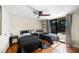 Bright bedroom with two beds, ceiling fan, and sliding doors to pool area at 3641 Stokes Dr, Sarasota, FL 34232