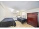 Bright bedroom with two beds, tile flooring, and and dressers at 3641 Stokes Dr, Sarasota, FL 34232
