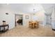 Dining room shows tile floors and a view into an office space plus views of the kitchen bar at 3641 Stokes Dr, Sarasota, FL 34232