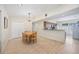Open dining area features overhead lighting and bar access to the kitchen with ample space for entertaining at 3641 Stokes Dr, Sarasota, FL 34232