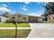 Charming single-story home with a covered carport and well-maintained front lawn at 3641 Stokes Dr, Sarasota, FL 34232
