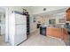 Bright kitchen with granite countertops, tile flooring, and modern appliances at 3641 Stokes Dr, Sarasota, FL 34232