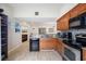 Bright kitchen with granite countertops, stainless steel appliances, and wood cabinets at 3641 Stokes Dr, Sarasota, FL 34232