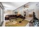 Spacious living room with an open floor plan, ceiling fan, and lots of light at 3641 Stokes Dr, Sarasota, FL 34232