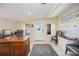 Bright home office with a large wooden desk, comfortable seating, and natural light at 3641 Stokes Dr, Sarasota, FL 34232