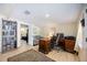 Well-organized office with a desk, bookshelf, and adjacent seating area at 3641 Stokes Dr, Sarasota, FL 34232