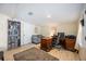Functional home office with a bookshelf, desk, seating area, and ample workspace at 3641 Stokes Dr, Sarasota, FL 34232