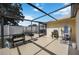 A covered, screened patio has a BBQ and exercise equipment at 3641 Stokes Dr, Sarasota, FL 34232