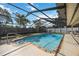 A covered, screened pool has updated steps at 3641 Stokes Dr, Sarasota, FL 34232