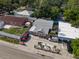 Charming home featuring a landscaped yard, privacy fence, and off-street parking at 3957 Proctor Rd, Sarasota, FL 34233