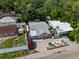 Cozy home featuring a landscaped yard, privacy fence, and off-street parking at 3957 Proctor Rd, Sarasota, FL 34233