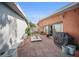 A spacious backyard with pavers, bench seating, grill, and open access from inside, perfect for entertaining at 3957 Proctor Rd, Sarasota, FL 34233