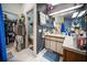 Bathroom showcasing walk-in closet, vanity with countertop, and shower at 3957 Proctor Rd, Sarasota, FL 34233