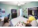 Bedroom with a queen-sized bed, ceiling fan, workstation and walk-in closet at 3957 Proctor Rd, Sarasota, FL 34233