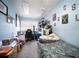 Bedroom features a single bed, workstation, and decorated walls at 3957 Proctor Rd, Sarasota, FL 34233