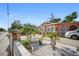 Delightful single-Gathering home with meticulous landscaping, complete with palm trees and white rock at 3957 Proctor Rd, Sarasota, FL 34233