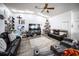 Spacious living room with wood floors, recessed lighting, ceiling fan, and lots of natural light at 3957 Proctor Rd, Sarasota, FL 34233