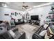 Spacious living room featuring wood floors, recessed lighting, ceiling fan, and lots of personal touches at 3957 Proctor Rd, Sarasota, FL 34233