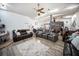 Spacious living room featuring wood floors, recessed lighting, ceiling fan and comfortable seating at 3957 Proctor Rd, Sarasota, FL 34233