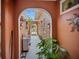 Beautiful outdoor corridor with an archway entry way, string lights, and unique decorations at 3957 Proctor Rd, Sarasota, FL 34233