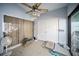 Bright sun room with tile flooring, ceiling fan, closet, sliding glass door, and lots of natural light at 3957 Proctor Rd, Sarasota, FL 34233