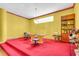 Brightly colored basement office area featuring large desk, ornate column accents, and natural light at 4105 37Th E St, Bradenton, FL 34208