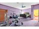 Bedroom with lavender walls and carpet, a ceiling fan, a workout area, and lots of space at 4105 37Th E St, Bradenton, FL 34208